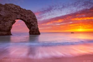 sunset durdle door rock arch presence fischer